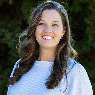 Image of the Organizational Leadership Advisor Ali Horsley smiling at the camera in an outdoor setting.