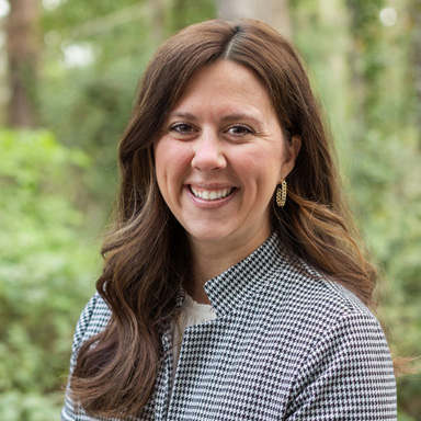 Image of the Criminal Justice Advisor lauren allen smiling at the camera in an outdoor setting.
